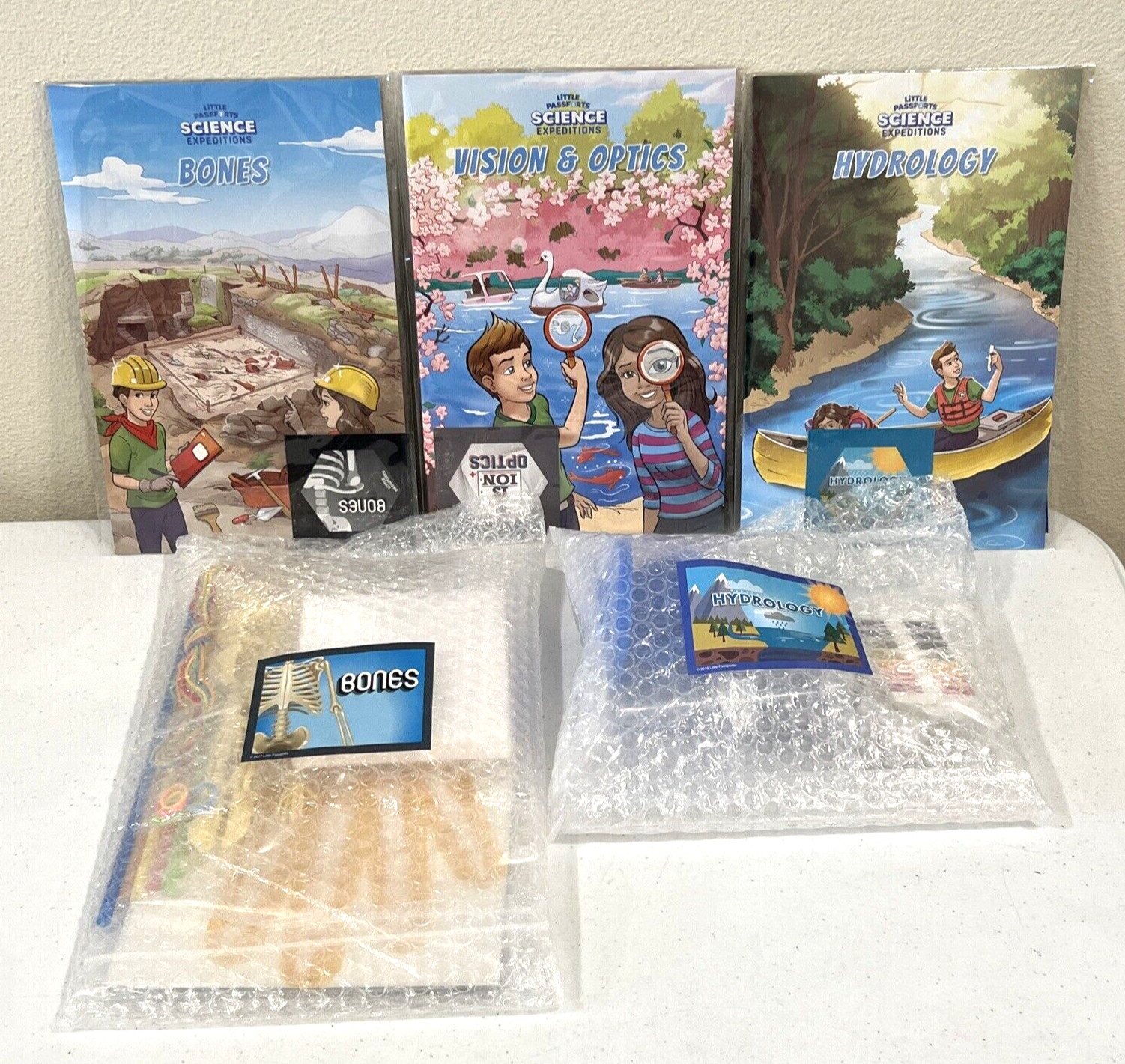 Little Passports Science Lot – Vision & Optics, Hydrology, & Bones