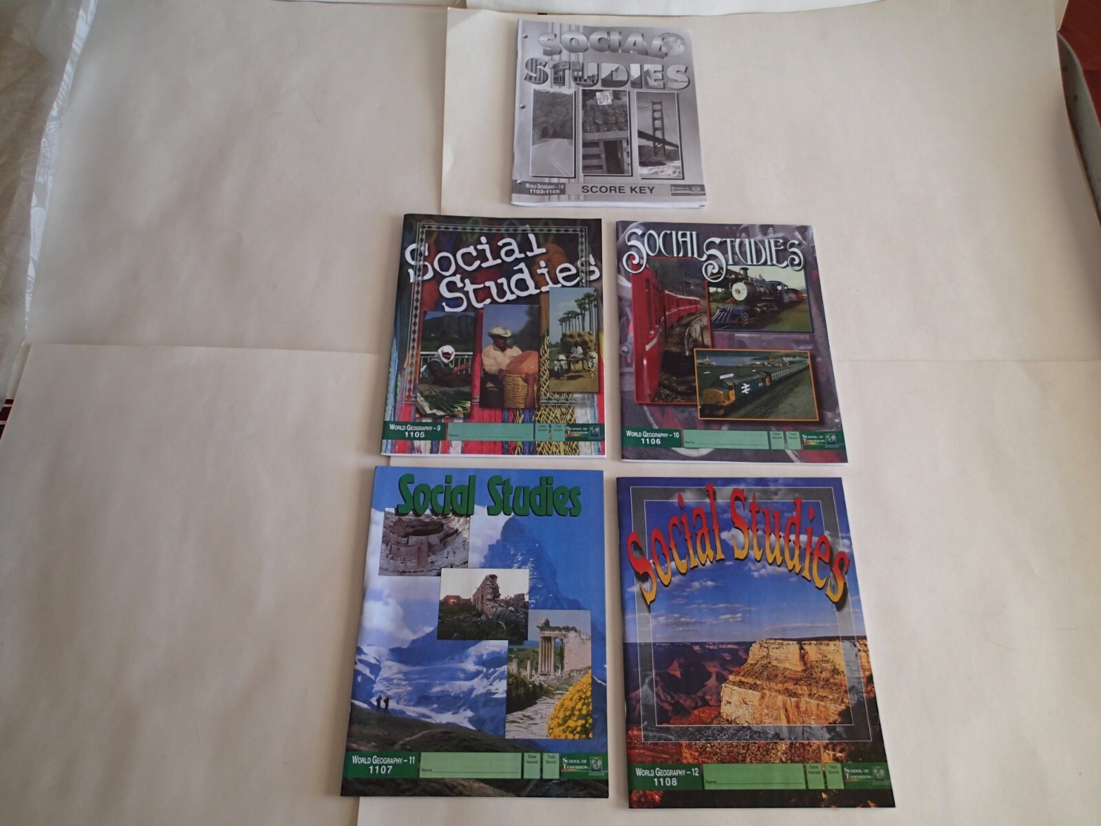 Set of 4 SCHOOL OF TOMORROW SOCIAL STUDIES WORKBOOKS with Tests, World Geography